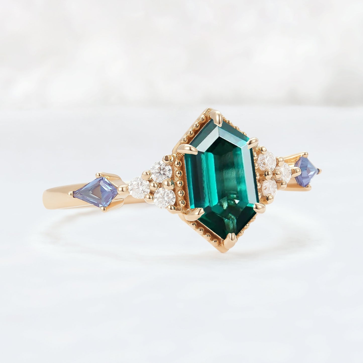 Unique Hexagon Cut Emerald and Moissanite Ring