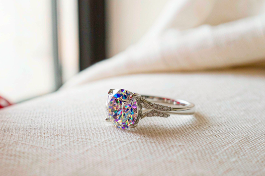 round brilliant moissanite engagement ring still sparkling brightly after years of daily wear on cream linen