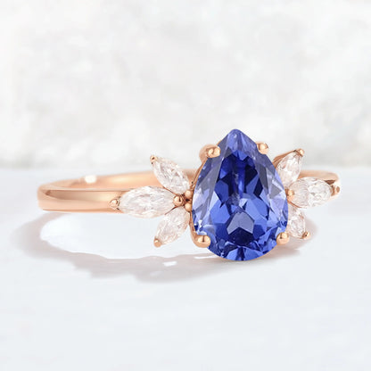 Nature Inspired Pear Cut Cornflower Sapphire with Petal Side Gemstone Ring