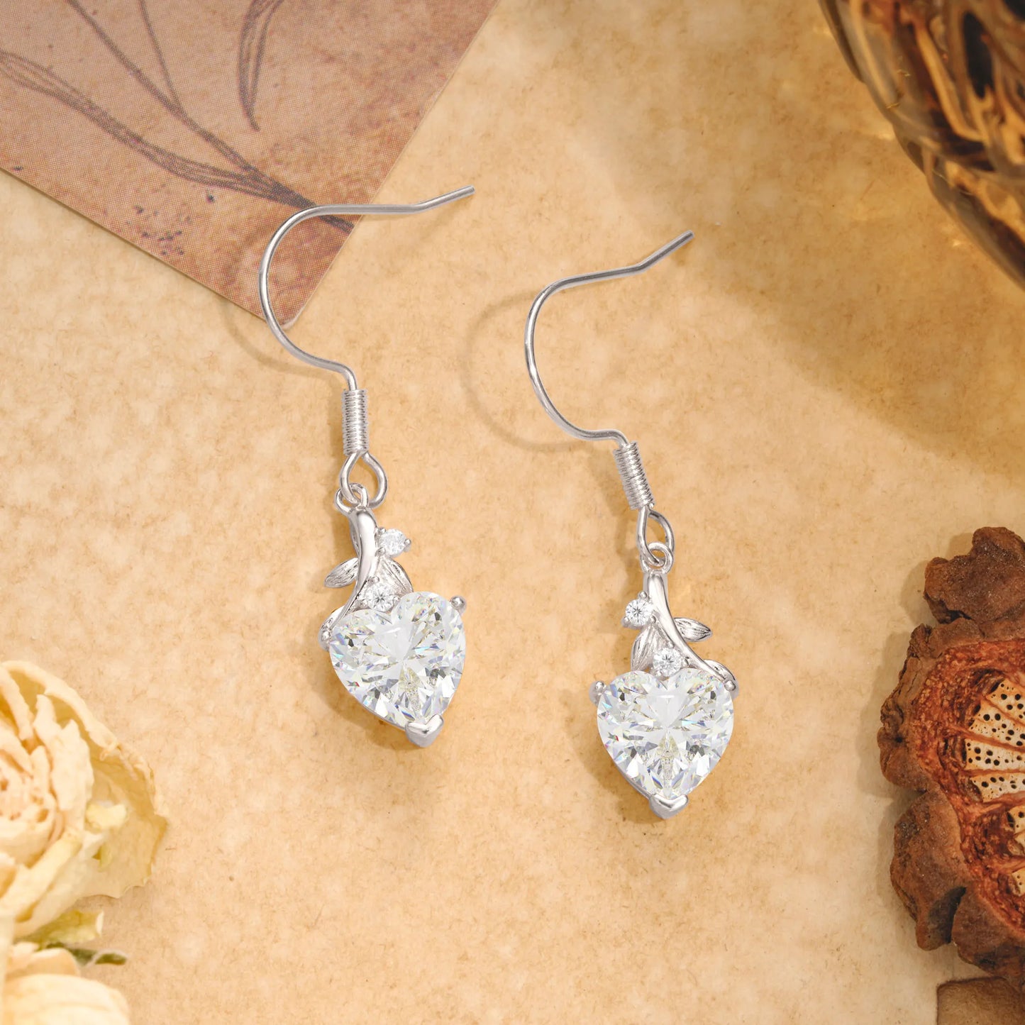 Elegant Heart Shape Moissanite Drop Earrings in Gold with Delicate Leaf Accent