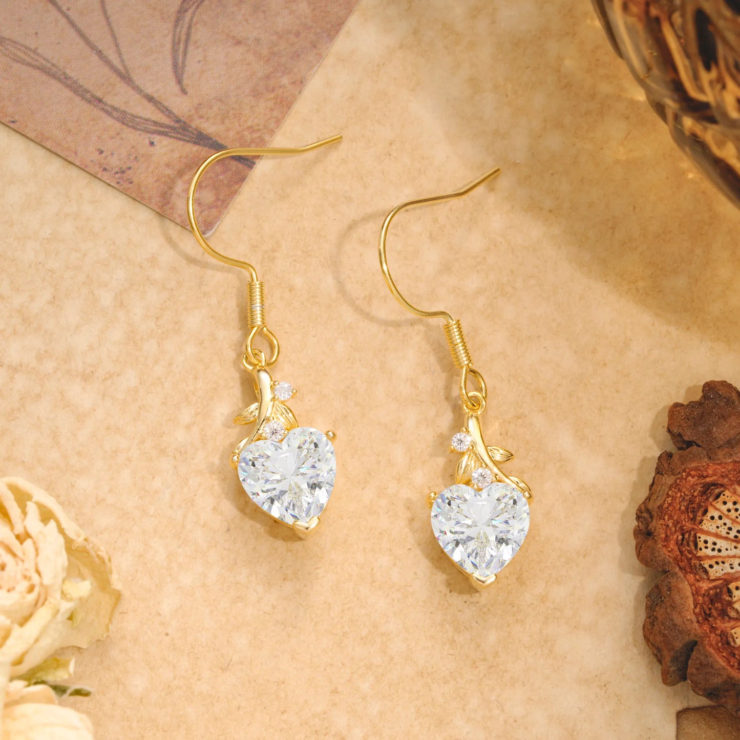 Elegant Heart Shape Moissanite Drop Earrings in Gold with Delicate Leaf Accent