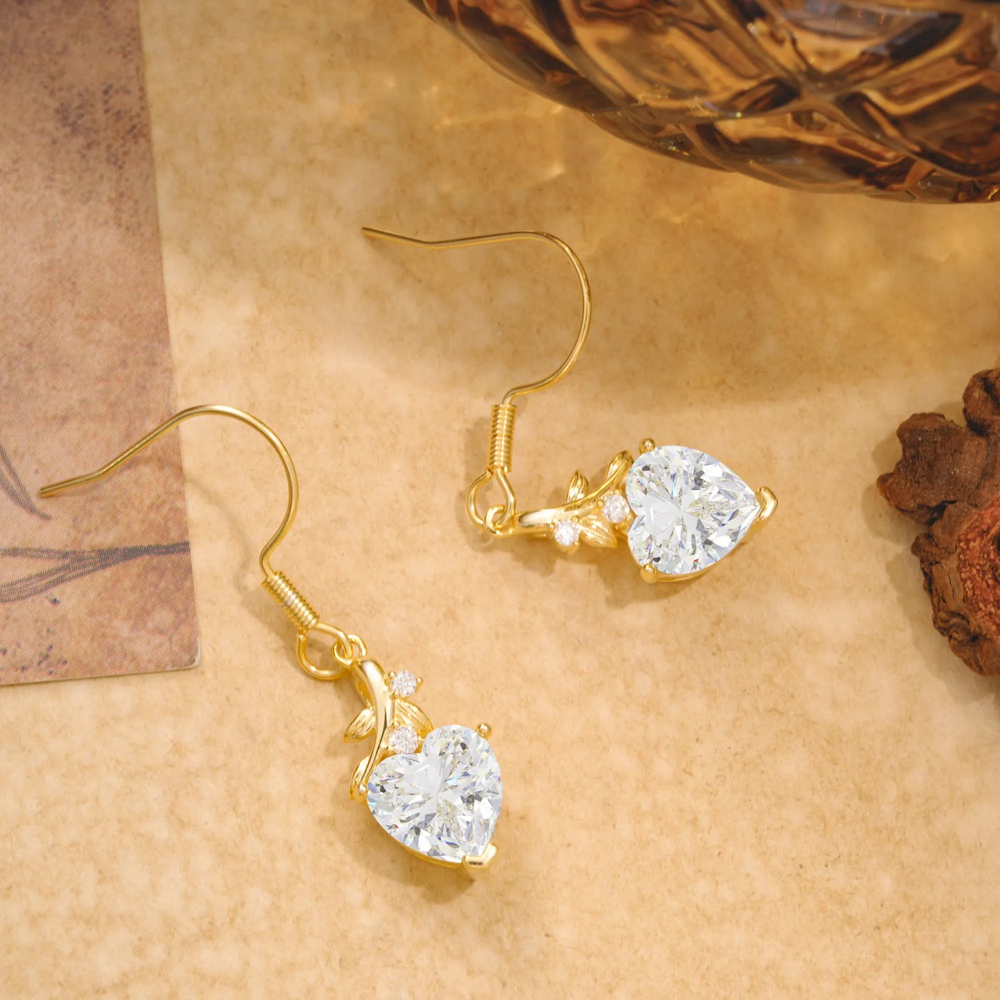 Elegant Heart Shape Moissanite Drop Earrings in Gold with Delicate Leaf Accent