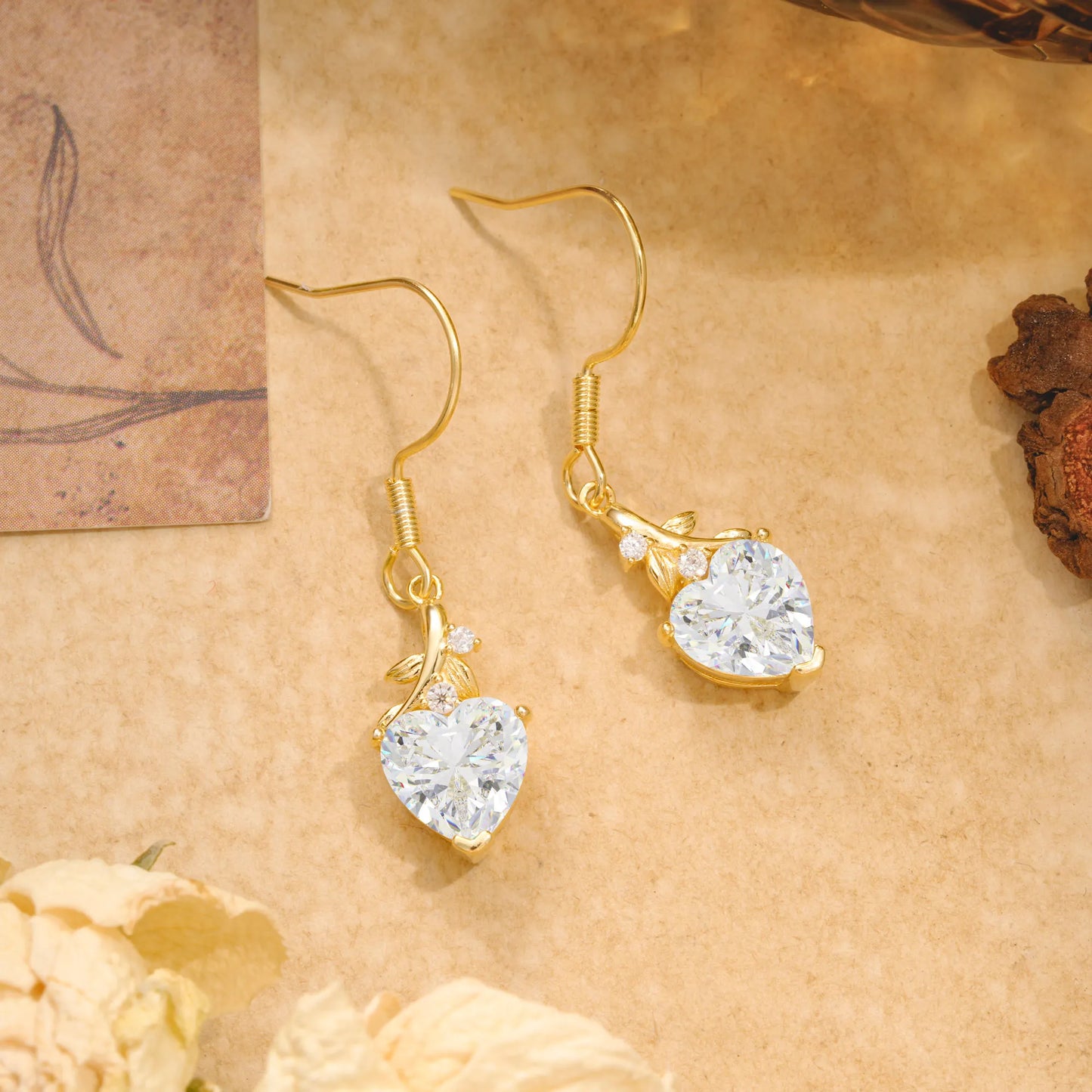 Elegant Heart Shape Moissanite Drop Earrings in Gold with Delicate Leaf Accent