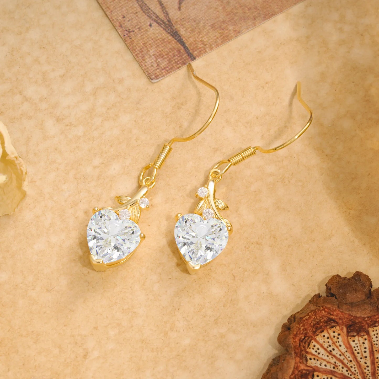 Elegant Heart Shape Moissanite Drop Earrings in Gold with Delicate Leaf Accent