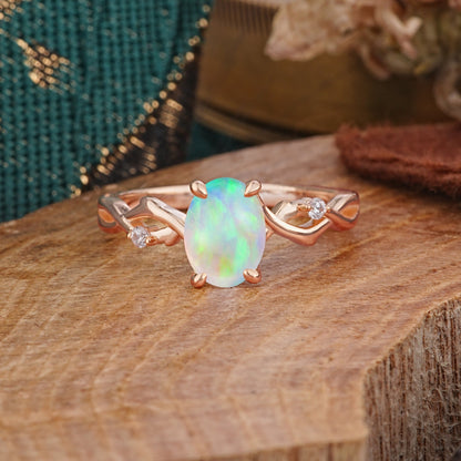 Artistic Twisted Shank Oval Cut Opal Engagement Ring