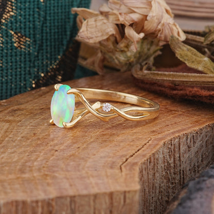 Artistic Twisted Shank Oval Cut Opal Engagement Ring