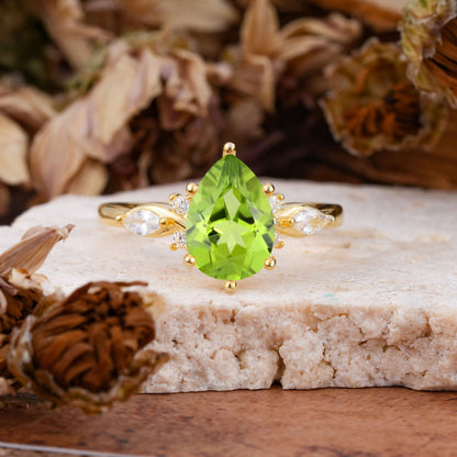 Vintage Pear Cut Peridot Three Side Stone Engagement Ring with Accents