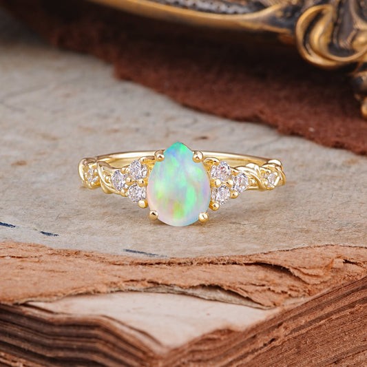 Nature-Inspired Vintage 4-Prong Pear Cut Opal Engagement Ring