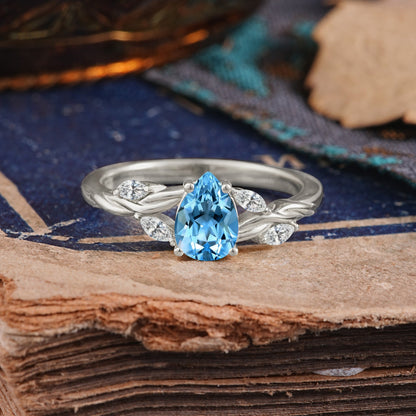 Exquisite 4-Prong Pear Cut Aquamarine Engagement Ring