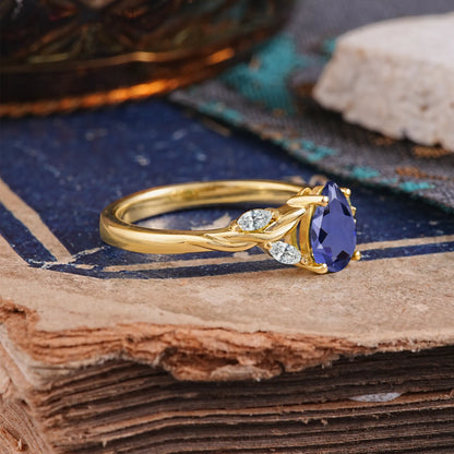 Exquisite 4-Prong Pear Cut Tanzanite Engagement Ring