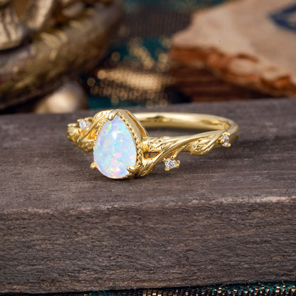 Nature-Inspired 3-Prong Pear-Cut Opal Engagement Ring
