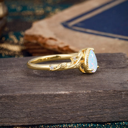 Nature-Inspired 3-Prong Pear-Cut Opal Engagement Ring
