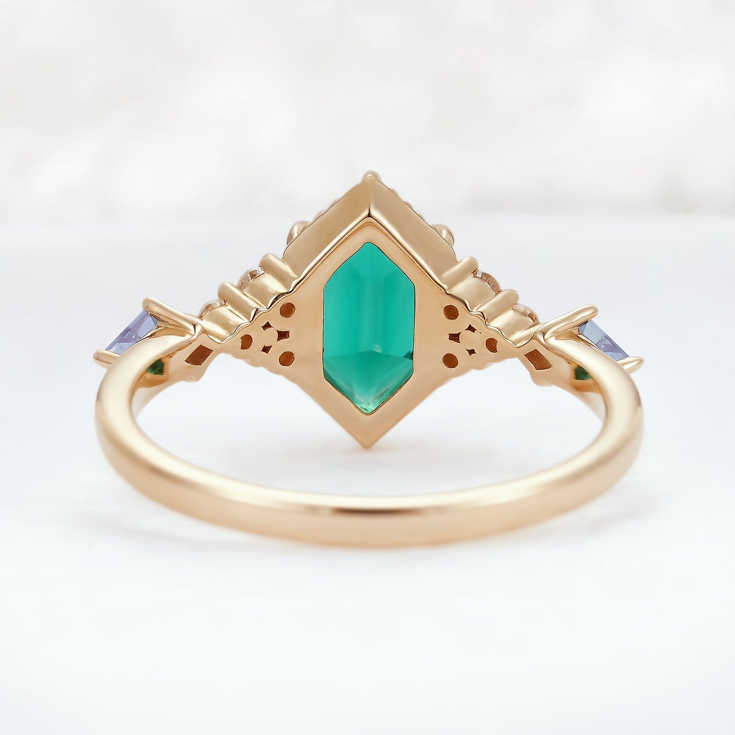 Unique Hexagon Cut Emerald and Moissanite Ring