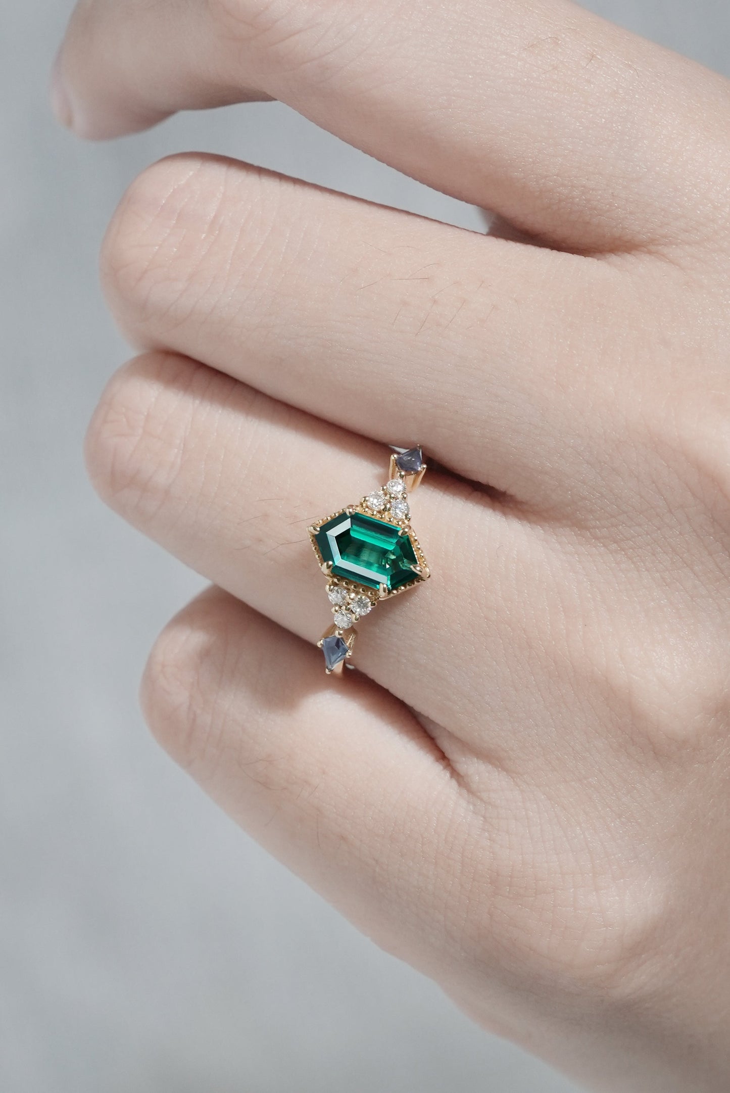 Unique Hexagon Cut Emerald and Moissanite Ring
