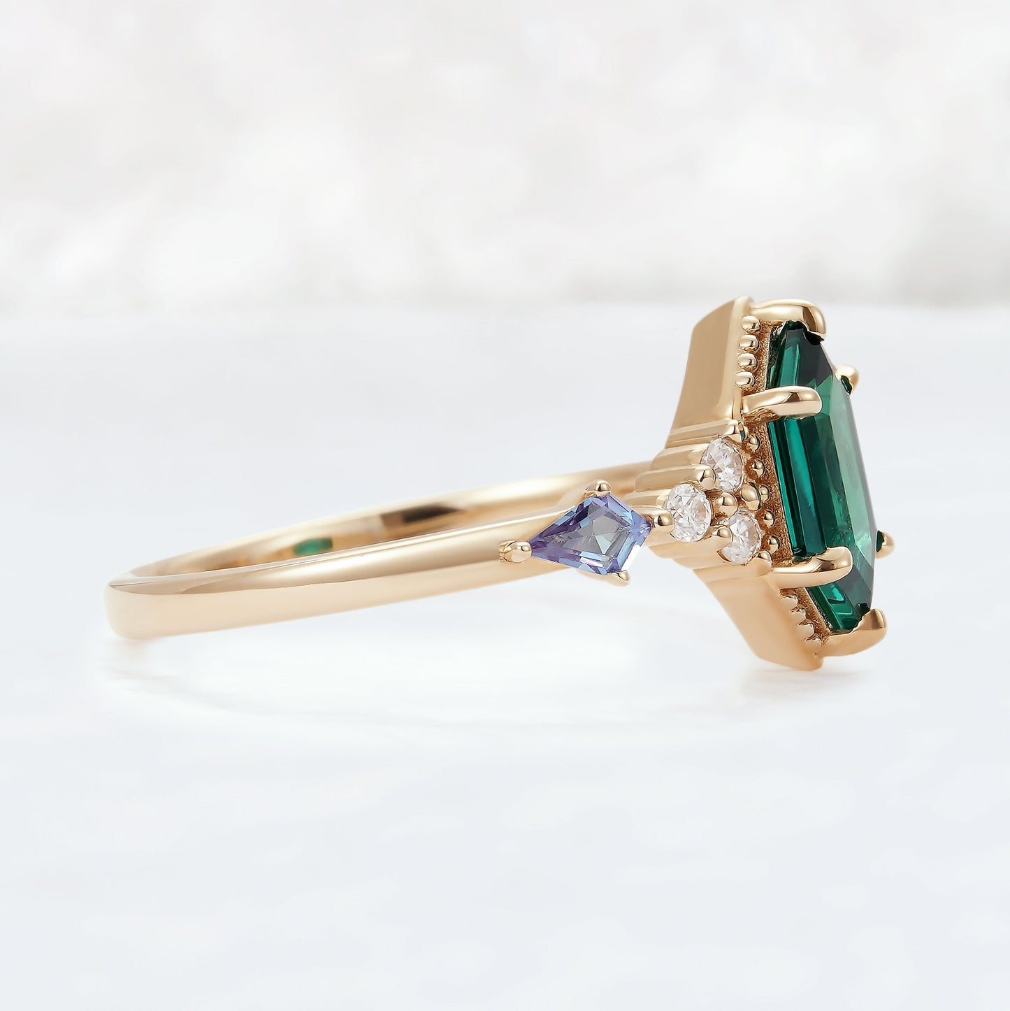 Unique Hexagon Cut Emerald and Moissanite Ring