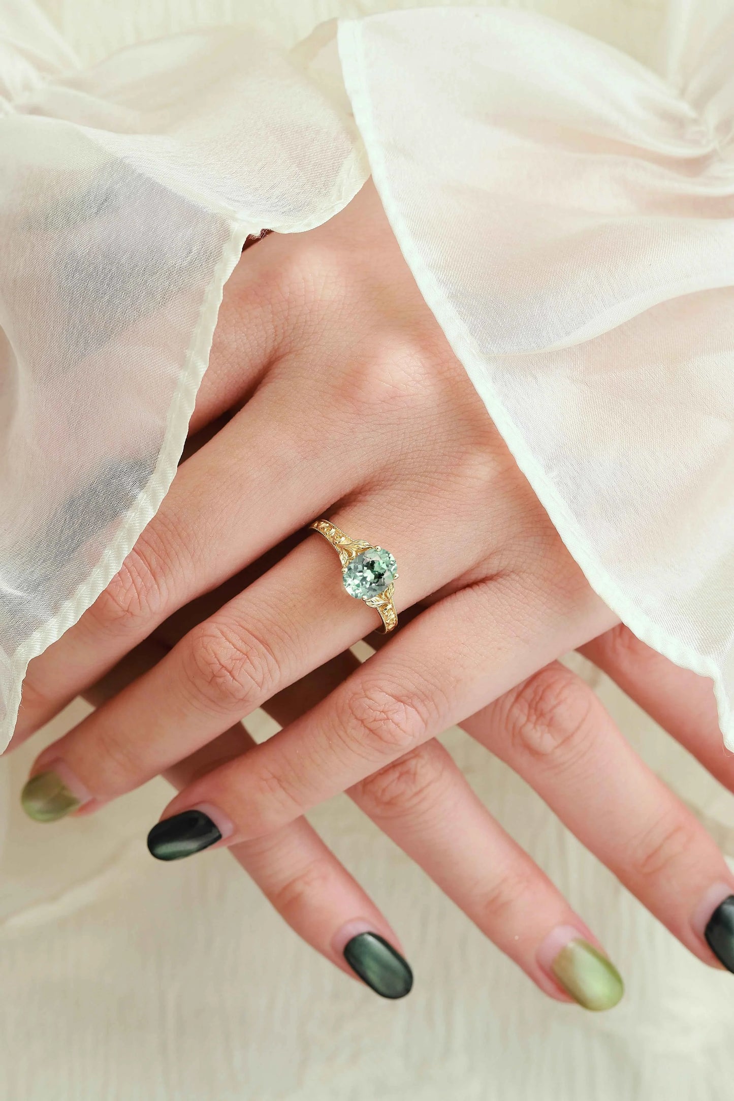 Oval-Cut Green Sapphire Engagement Ring with Leaf-Embraced Band